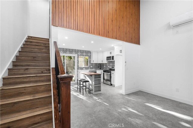 staircase with a wall unit AC