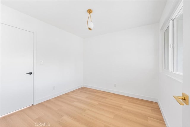 unfurnished room featuring hardwood / wood-style flooring