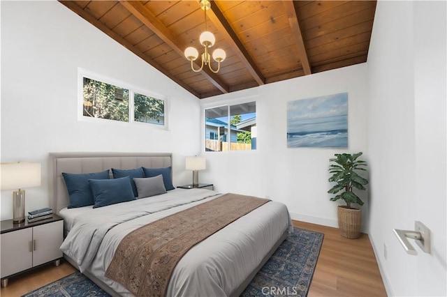 bedroom featuring light wood-type flooring, wooden ceiling, a notable chandelier, and lofted ceiling with beams