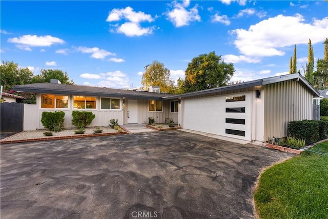 single story home featuring a garage