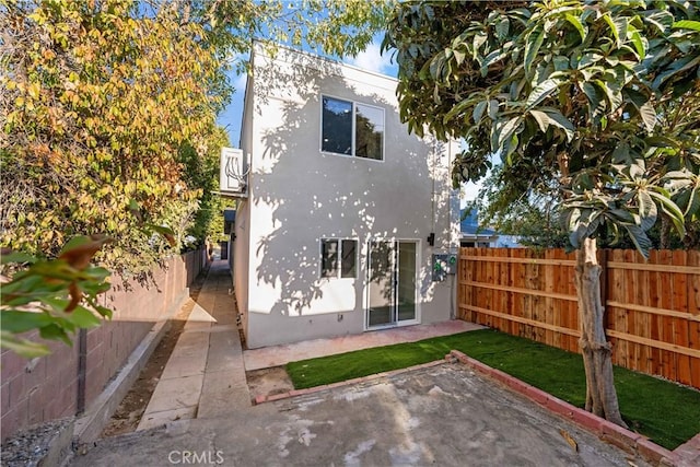 rear view of house with a patio