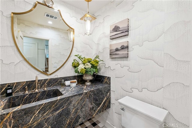 bathroom with sink and toilet