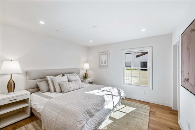 bedroom with light hardwood / wood-style flooring