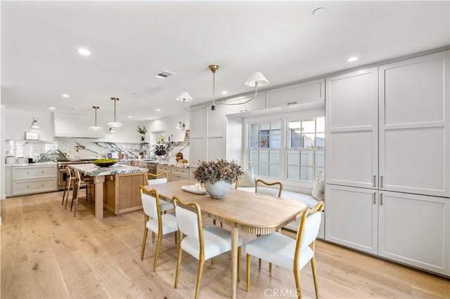 dining space featuring light hardwood / wood-style floors