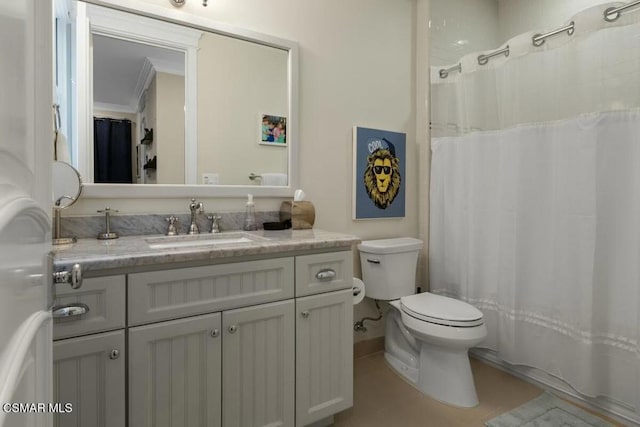 bathroom with toilet, vanity, ornamental molding, and tile patterned flooring