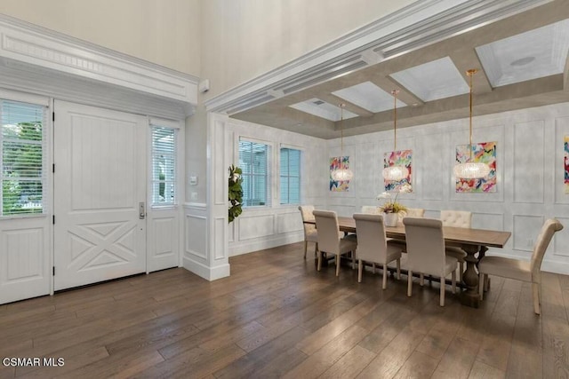 dining room featuring beam ceiling, dark hardwood / wood-style floors, a wealth of natural light, and coffered ceiling