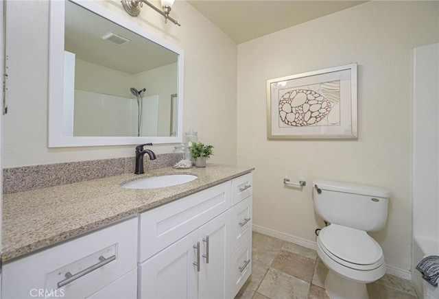 bathroom with toilet and vanity