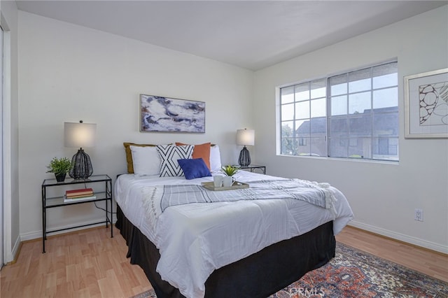 bedroom featuring light wood-type flooring