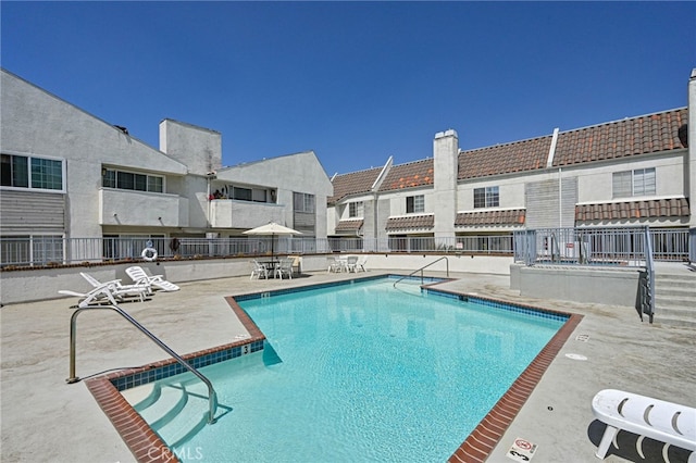 view of pool featuring a patio