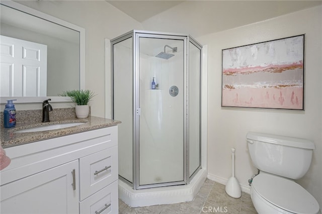 bathroom with tile patterned flooring, toilet, a shower with door, and vanity