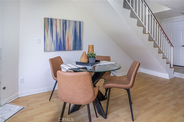 dining area with hardwood / wood-style flooring