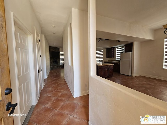 hall with tile patterned flooring