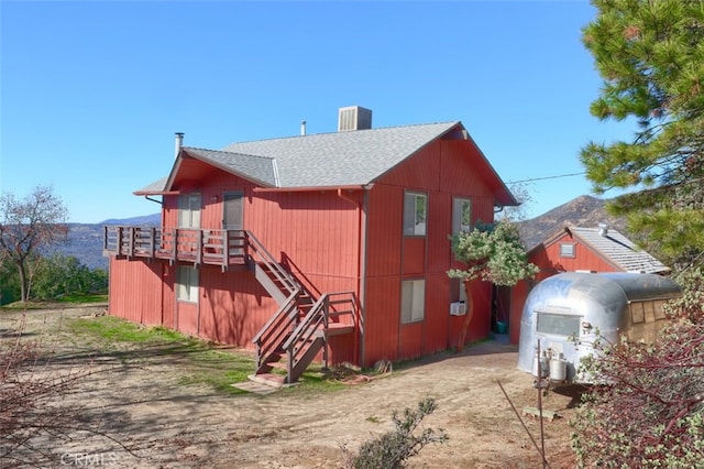 rear view of house with a mountain view