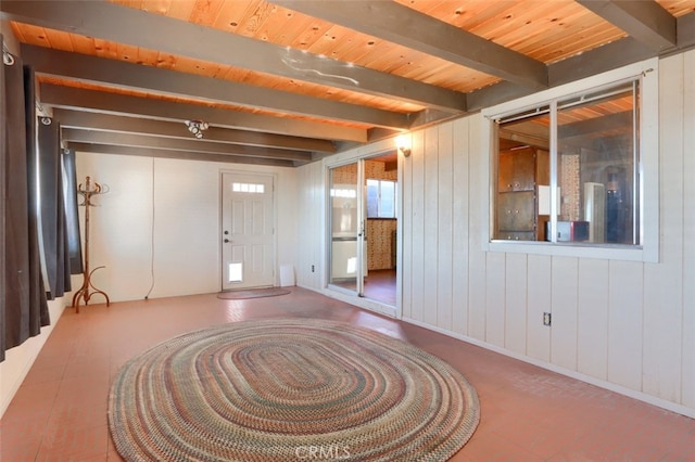 entrance foyer featuring beamed ceiling and wooden ceiling