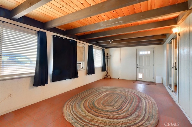 foyer entrance featuring plenty of natural light and beam ceiling