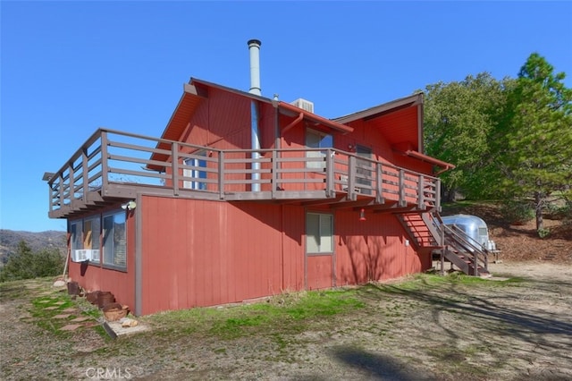 view of property exterior featuring a deck