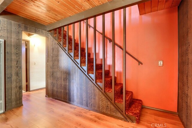 stairs with wood-type flooring