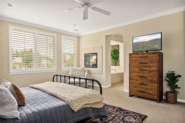 carpeted bedroom featuring ceiling fan, connected bathroom, and ornamental molding