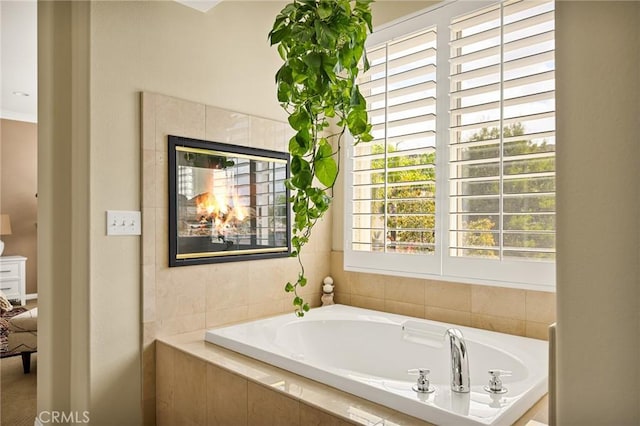 bathroom with a relaxing tiled tub