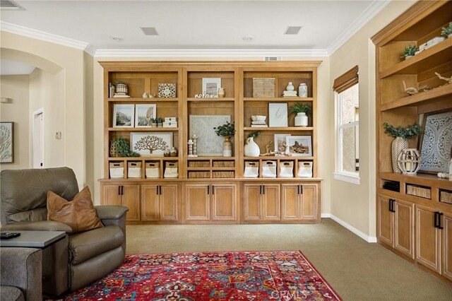 living area featuring light carpet and crown molding