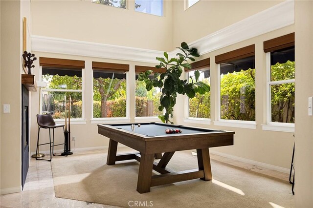 rec room with a wealth of natural light, billiards, and light carpet