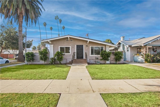 ranch-style home featuring a front lawn