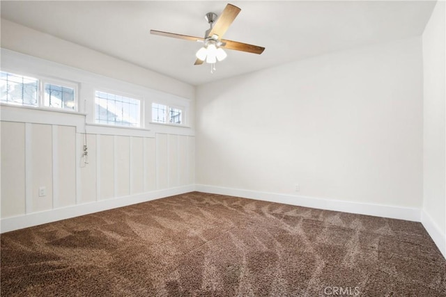 unfurnished room with carpet and ceiling fan