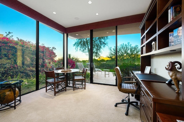 home office with light carpet and plenty of natural light