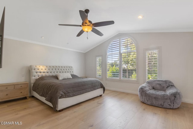 bedroom with vaulted ceiling, ceiling fan, ornamental molding, and light hardwood / wood-style floors