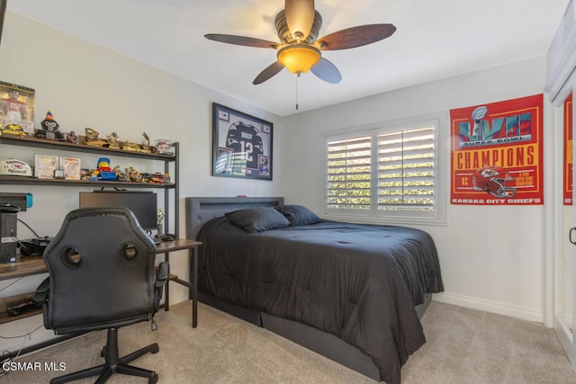 carpeted bedroom featuring ceiling fan