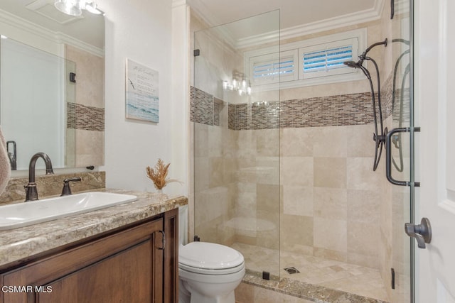 bathroom with an enclosed shower, vanity, crown molding, and toilet