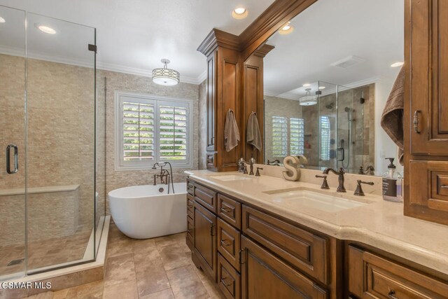 bathroom featuring plus walk in shower, tile walls, tile patterned floors, crown molding, and vanity