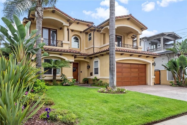 mediterranean / spanish-style home with a balcony, a front lawn, and a garage