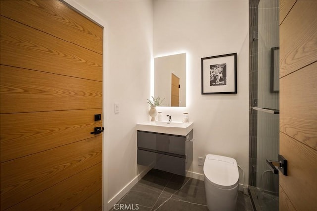 bathroom featuring tile patterned flooring, vanity, and toilet