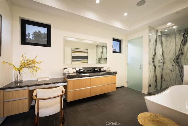 bathroom featuring vanity, tile patterned floors, and separate shower and tub