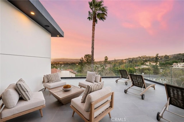 patio terrace at dusk with an outdoor hangout area