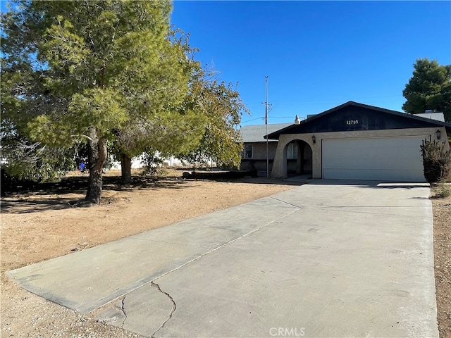 single story home with a garage