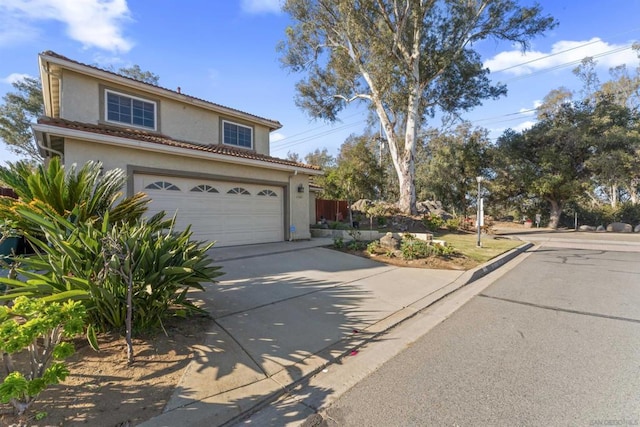 front of property with a garage