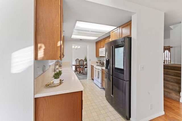 kitchen featuring sink and white appliances