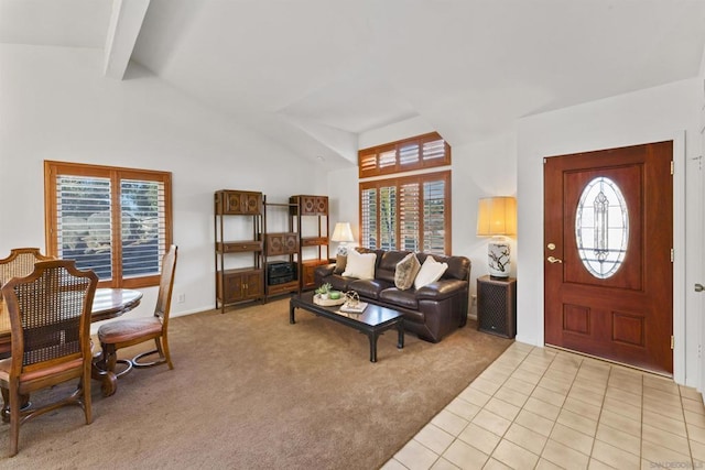 carpeted living room featuring vaulted ceiling with beams