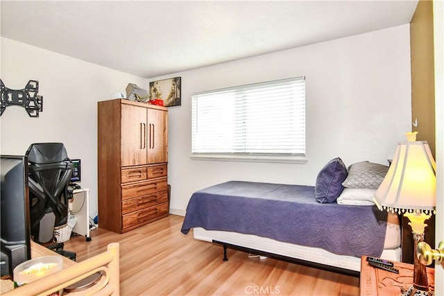 bedroom with light hardwood / wood-style floors