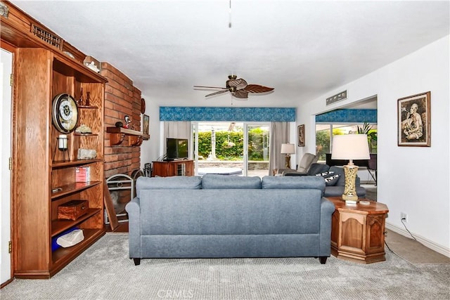 living room featuring ceiling fan and light carpet