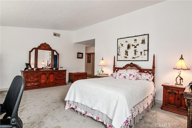 carpeted bedroom featuring vaulted ceiling