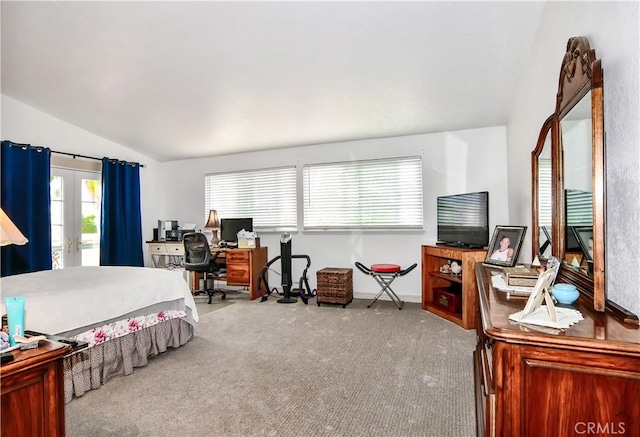 carpeted bedroom featuring lofted ceiling