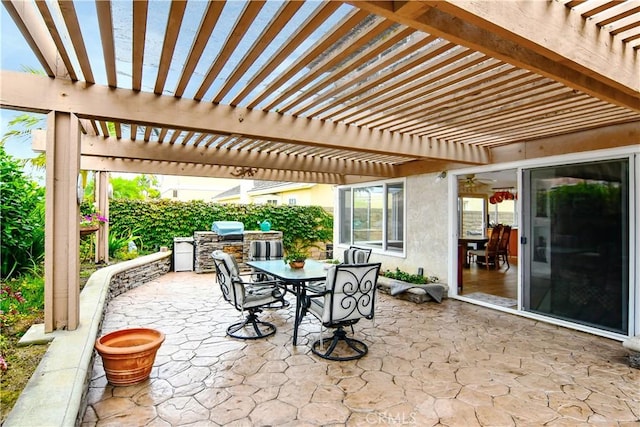 view of patio / terrace featuring a pergola, a grill, and exterior kitchen