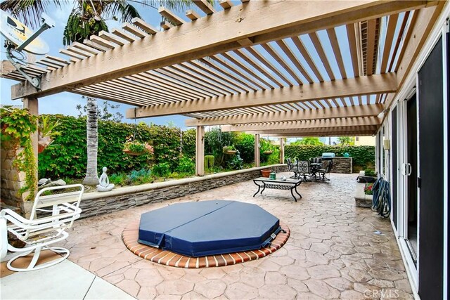 view of patio / terrace featuring a covered hot tub and a pergola