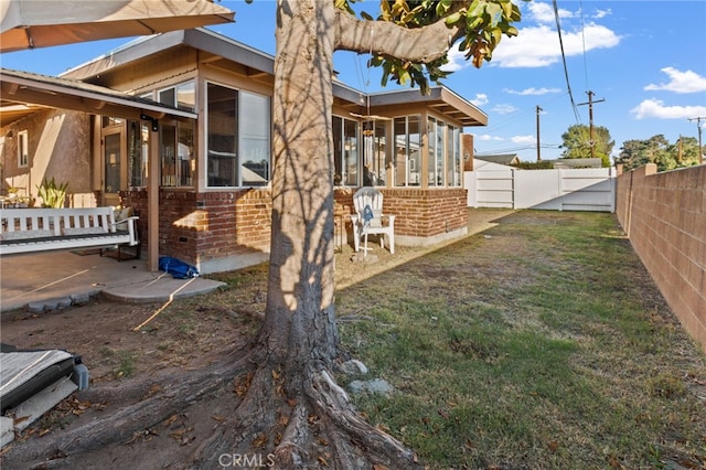 view of side of property featuring a sunroom