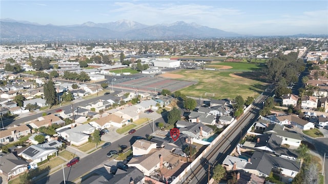 birds eye view of property featuring a mountain view