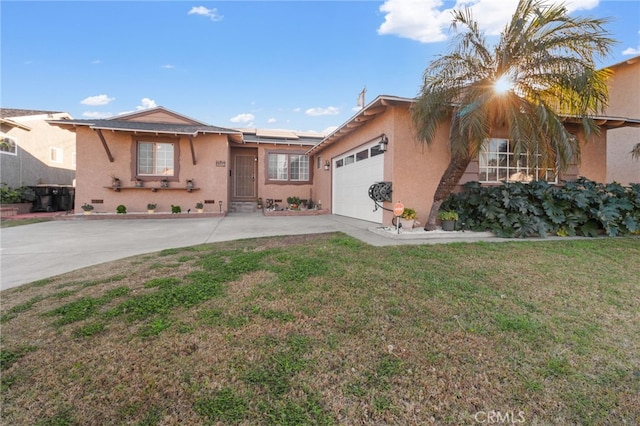 single story home featuring solar panels, a front lawn, and a garage