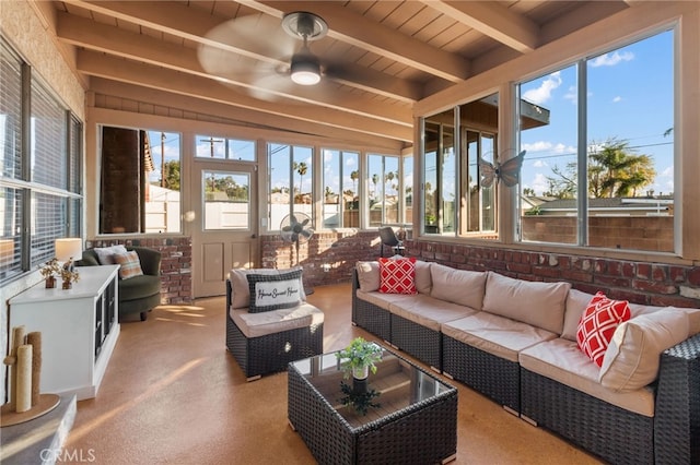 sunroom / solarium with wood ceiling, beam ceiling, and ceiling fan